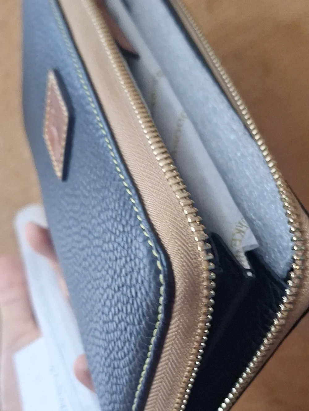 Dooney & Bourke Black Pebbled Zip Wallet with Tan Trim
